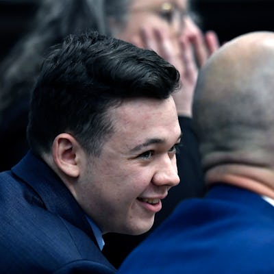 KENOSHA, WISCONSIN - NOVEMBER 18: Kyle Rittenhouse speaks with his attorneys before the jury is reli...