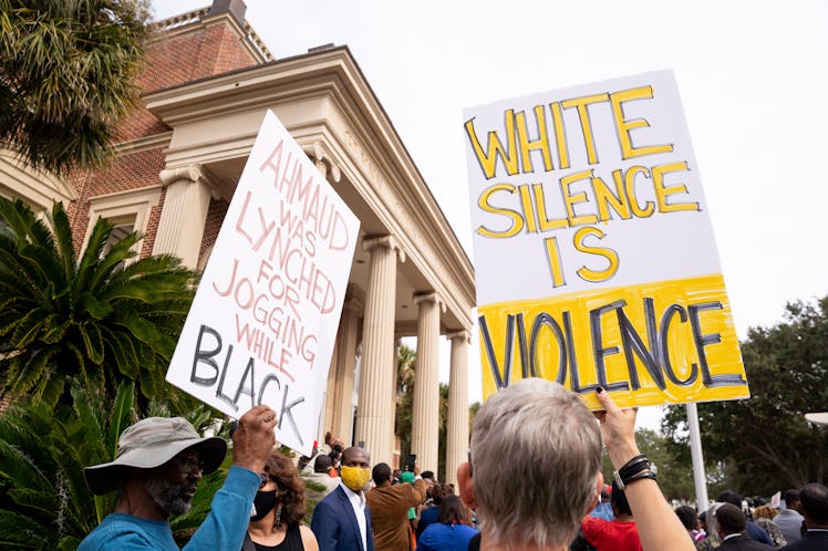 BRUNSWICK, GA - NOVEMBER 18: Demonstrators gather outside the Glynn County Courthouse during the tri...