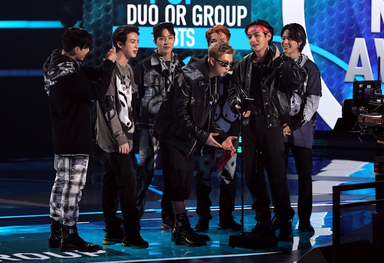 LOS ANGELES, CALIFORNIA - NOVEMBER 21: (L-R) Jungkook, Jin, J-Hope, RM (speaking), Suga, V, and Jimi...