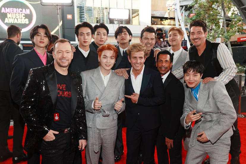 LOS ANGELES, CALIFORNIA - NOVEMBER 21: (L-R) Jimin of BTS, Donnie Wahlberg of New Kids On The Block ...