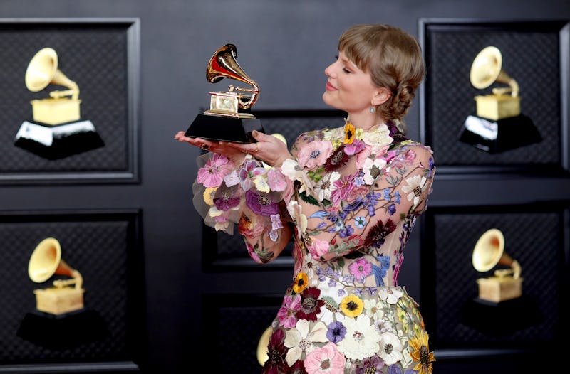 Los Angeles, CA - March 14: 
Taylor Swift with her Grammy on the red carpet at the 63rd Annual Gramm...