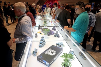 SANTA ANA, CA - JUNE 24: Eka Chai, right, checks out a display case with merchandise at a VIP Event ...