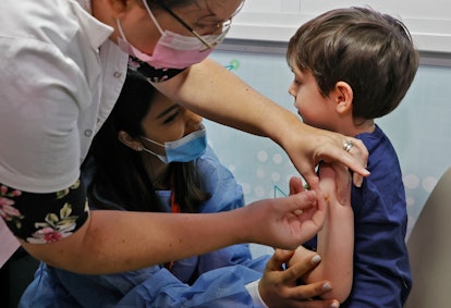 Israeli boy Itamar, 5, receives a dose of the Pfizer/BioNTech Covid-19 vaccine at the Meuhedet Healt...
