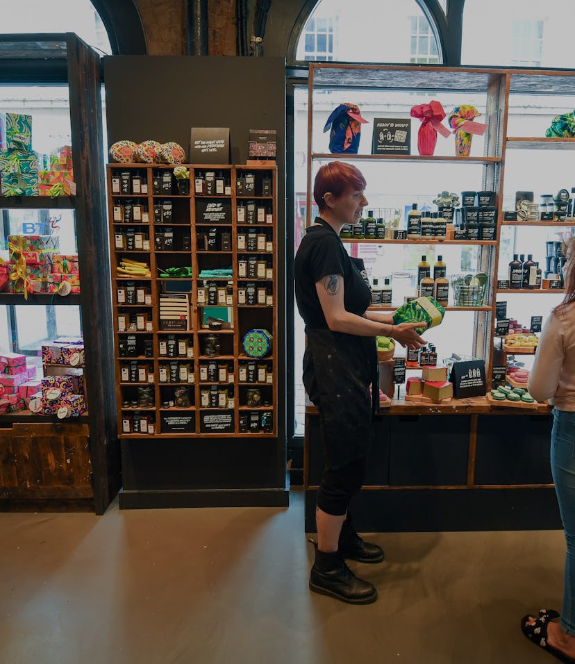 BOURNEMOUTH, ENGLAND - JUNE 15: People wearing protective face masks shop in Lush in the town centre...