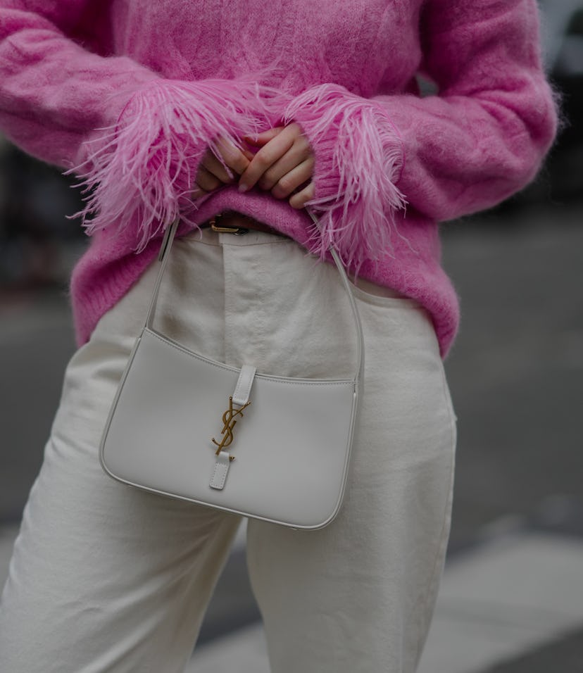 PARIS, FRANCE - NOVEMBER 20: Katie Giorgadze @katie.one wears a pink knitted mohair sweater with fea...