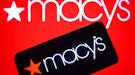 UKRAINE - 2021/11/20: In this photo illustration, Macy's logo seen on a smartphone and a pc screen. ...