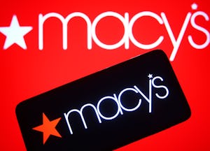 UKRAINE - 2021/11/20: In this photo illustration, Macy's logo seen on a smartphone and a pc screen. ...