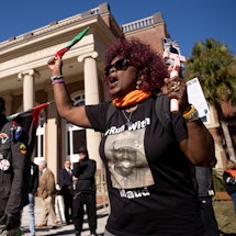 Carolyn Ruff demonstrates outside of the Glynn County Courthouse as jury deliberations begin in the ...