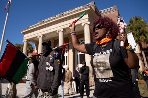 Carolyn Ruff demonstrates outside of the Glynn County Courthouse as jury deliberations begin in the ...