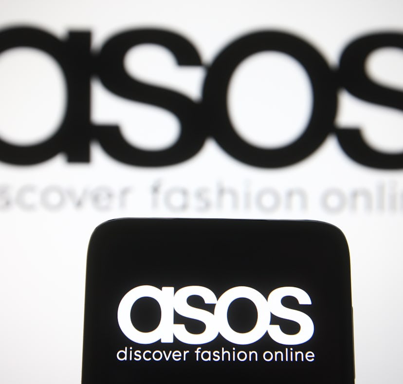 UKRAINE - 2021/04/09: In this photo illustration the ASOS logo of a British online fashion and cosme...