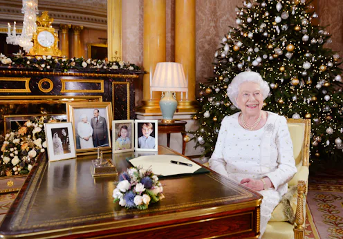 LONDON, UNITED KINGDOM - In this undated image supplied by Sky News, Queen Elizabeth II sits at a d...
