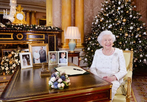 LONDON, UNITED KINGDOM -  In this undated image supplied by Sky News, Queen Elizabeth II sits at a d...