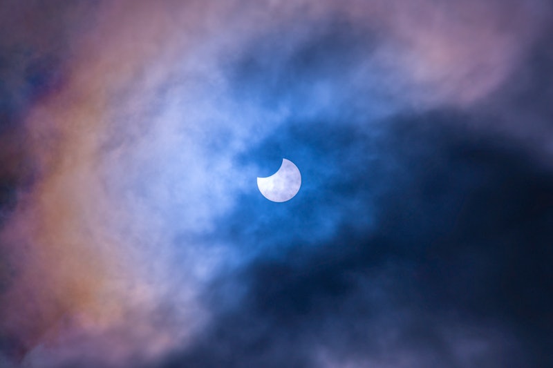 A solar eclipse occurs when a portion of the Earth is engulfed in a shadow cast by the Moon which fu...