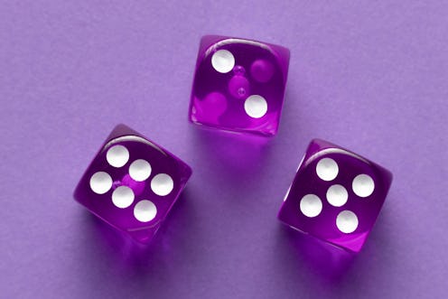 Purple dices on purple background