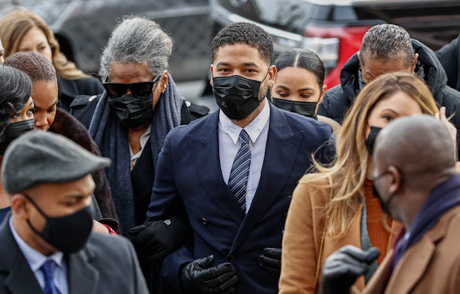 Jussie Smollett, center, arrives at the Leighton Criminal Court Building for the beginning of his tr...