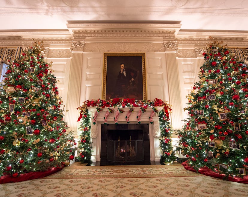 Christmas trees are seen in the State Dining room during a press preview of the White House holiday ...