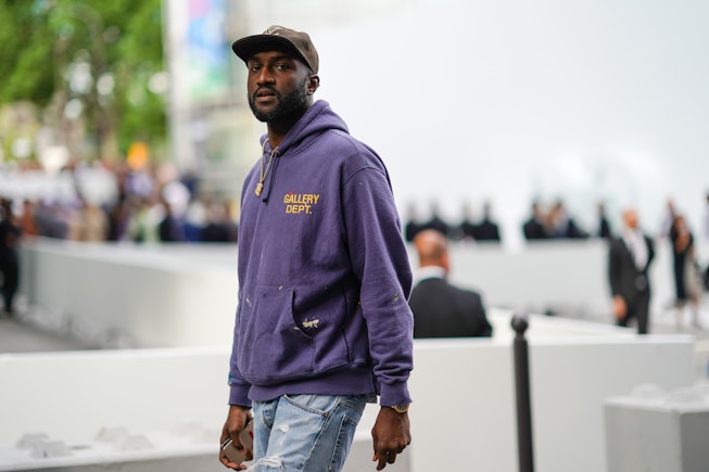 PARIS, FRANCE - JUNE 21: Virgil Abloh wears a Vuitton cap, a purple "Gallery Dept." hoodie sweater, ...
