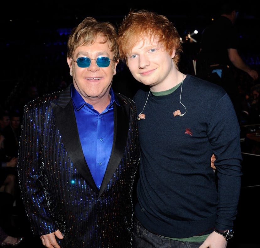 Ed Sheeran and Elton John announced their holiday single by recreating a scene from 'Love Actually.'...