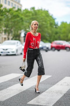 PARIS, FRANCE - JULY 06: Leonie Hanne wears gold Chanel earrings, a gold Chanel large chain pendant ...