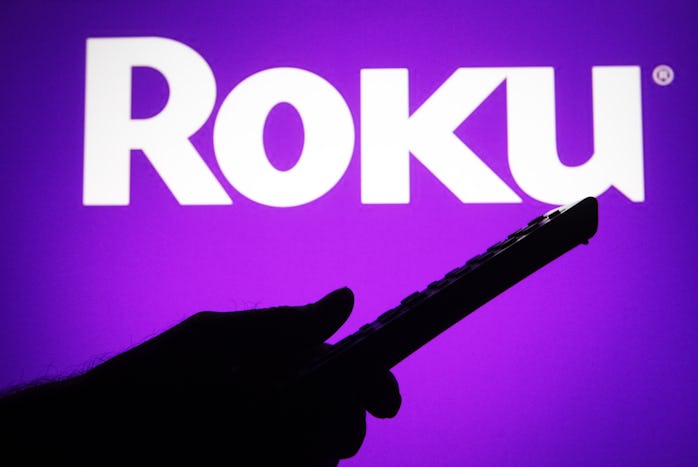 UKRAINE - 2021/07/04: In this photo illustration a Roku logo is seen on a screen with a silhouette o...