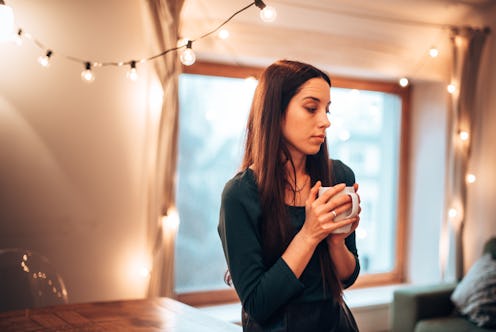 teenager woman with the mug of coffee during the christmas holiday