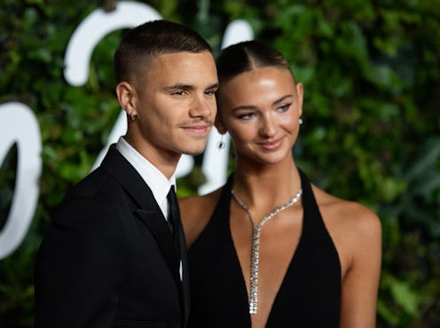 Romeo Beckham and Mia Regan attend The Fashion Awards 2021 