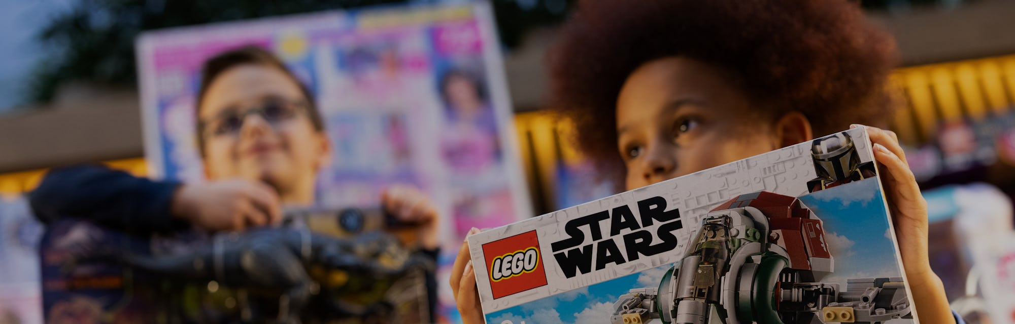 LONDON, ENGLAND - NOVEMBER 02: Philip Kamau, 11, poses with a 'Star Wars Boba Fett Starship', one of...