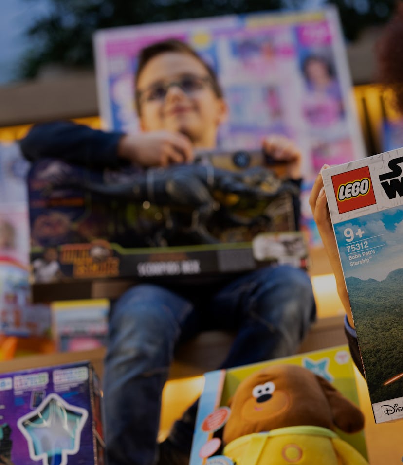 LONDON, ENGLAND - NOVEMBER 02: Philip Kamau, 11, poses with a 'Star Wars Boba Fett Starship', one of...