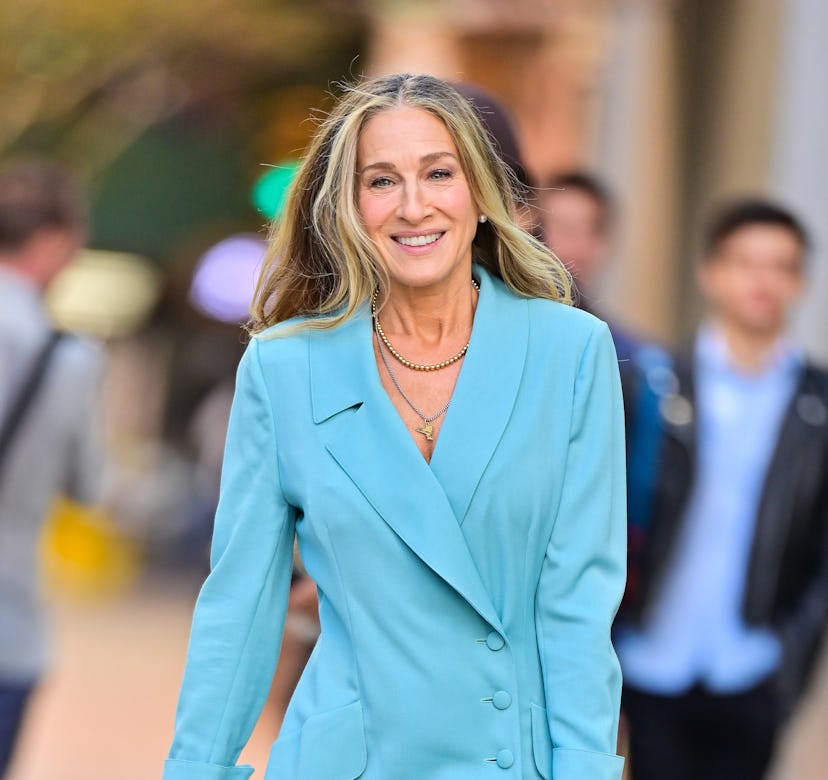 Sarah Jessica Parker wearing a bright blue suit on set.