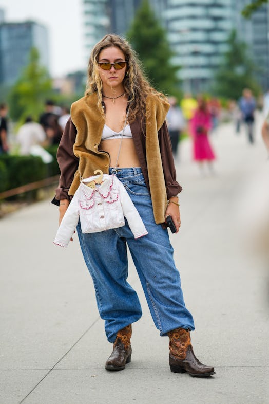 Baggy jeans with cowboy boots in street style.