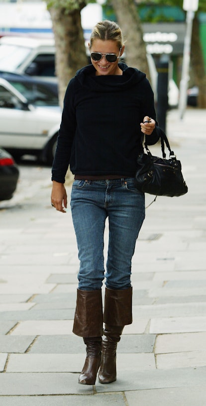 LONDON - SEPTEMBER 1:  Model Kate Moss walks down a North London street September 1, 2003 in North L...