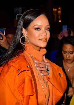 Rihanna wears Fenty orange turtleneck and parka in 2020.