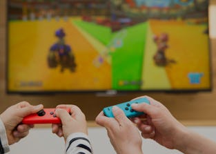 Mother and child playing video game. (Photo by: BSIP/Universal Images Group via Getty Images)