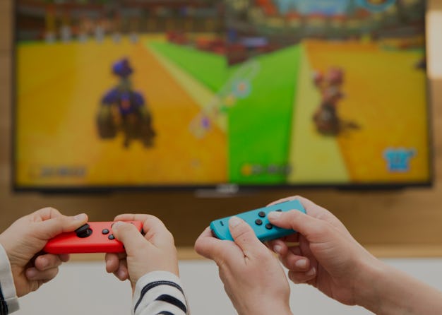 Mother and child playing video game. (Photo by: BSIP/Universal Images Group via Getty Images)
