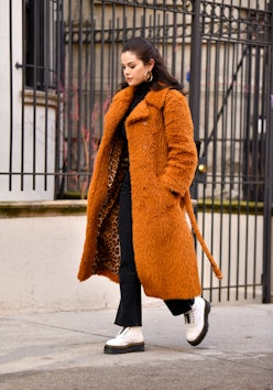 Selena Gomez wears orange coat in New York City, 2021.