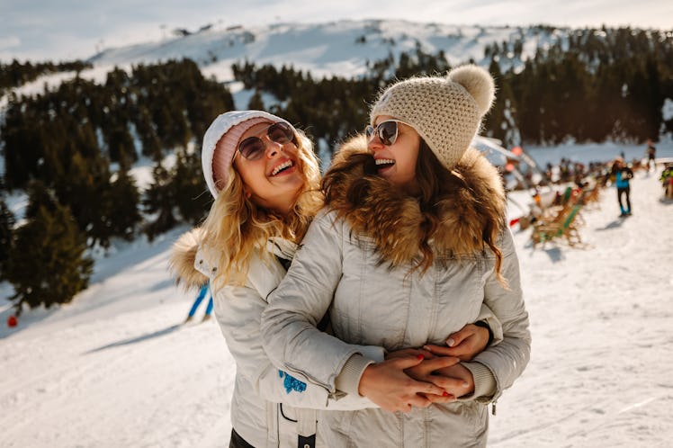 Young couple on the ski slopes, thinking about how winter 2021 will be the most romantic season for ...