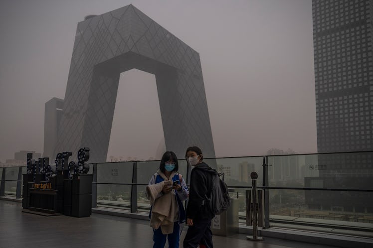 BEIJING, CHINA - NOVEMBER 05: Two women are seen in front of the CCTV headquarters during a highly p...