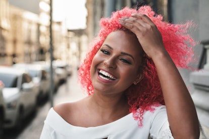A Scorpio woman shows off her new hair color, for which she'll need savage Scorpio quotes as Instagr...