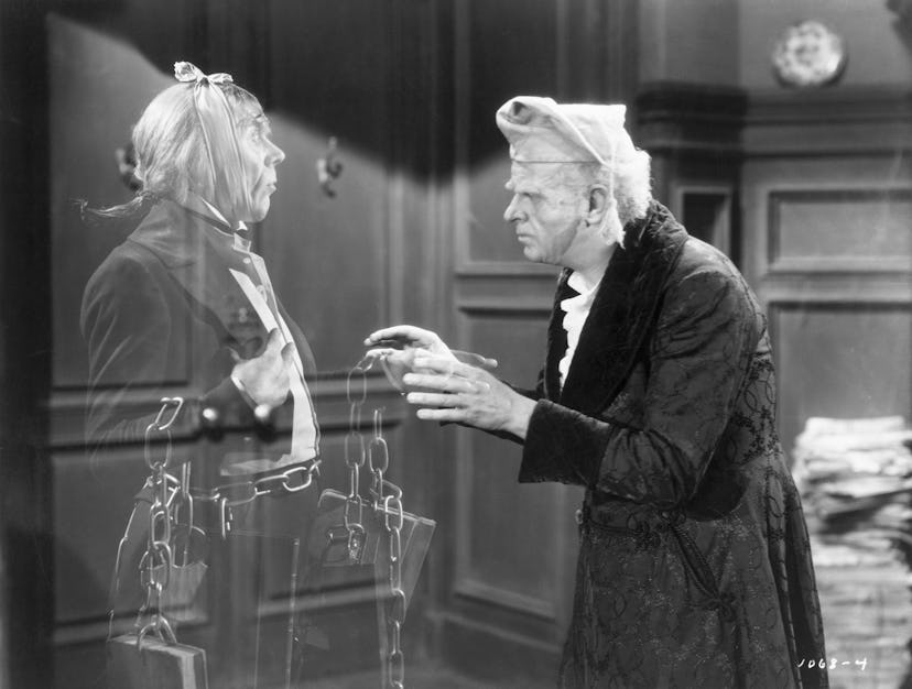 (Original Caption) Reginald Owen, playing Scrooge, speaks with his dead business partner Marley, pla...
