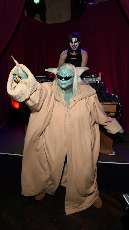 Lizzo dressed as Yoda for Halloween performs onstage during the Ghost Town Halloween Party.