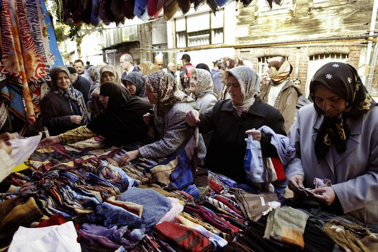 Turkish Moslem women looking for clothes at the Fatih bazaar 31 October 2003 on the first Friday of ...