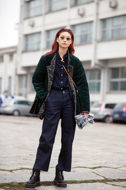 MILAN, ITALY - FEBRUARY 23: Korean model Hoyeon Jung wears a green sunglasses, a  green velvet jacke...