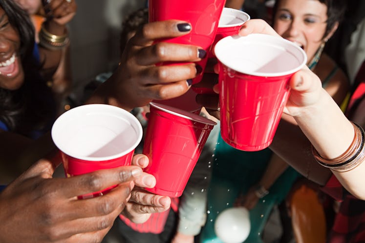 Flip cup is a perfect Friendsgiving drinking game for a big group of people.