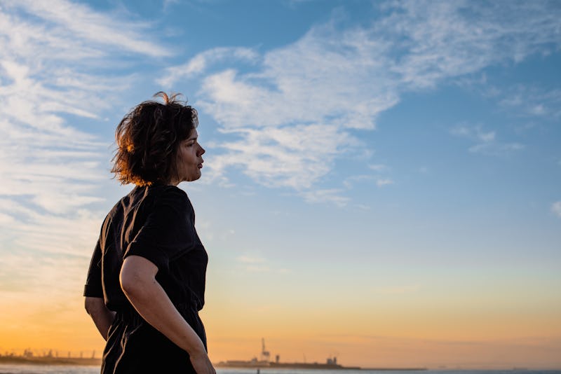 woman looking at the sunset