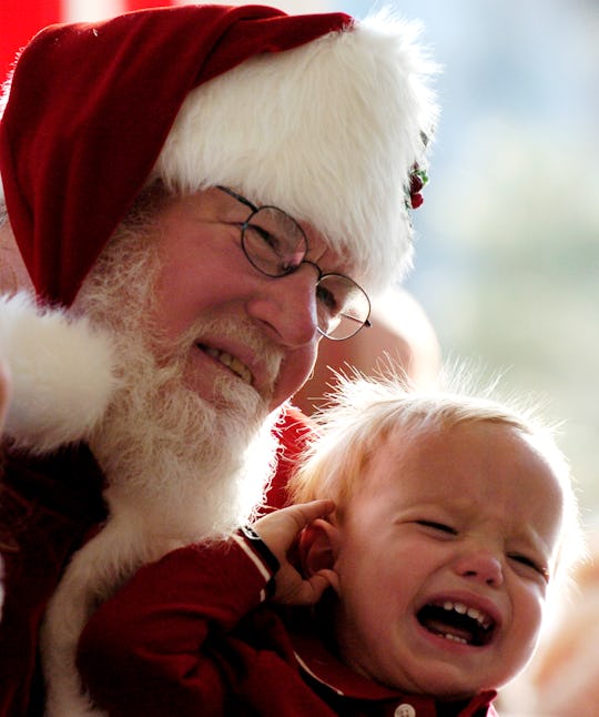 DENVER,CO--NOVEMBER 26TH 2006--Sam Ament, <cq> 18-months-old, <cq> cries in Santa's lap Sunday after...