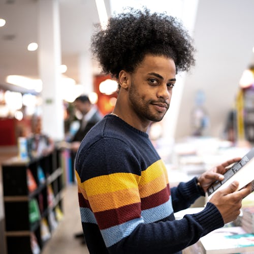 Portrait of a young man in a bookstore at the mall