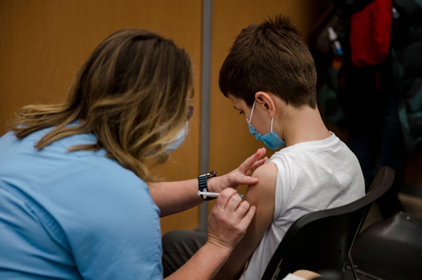 A child, 11, receives the Pfizer-BioNTech Covid-19 vaccine for children in Montreal, Quebec on Novem...