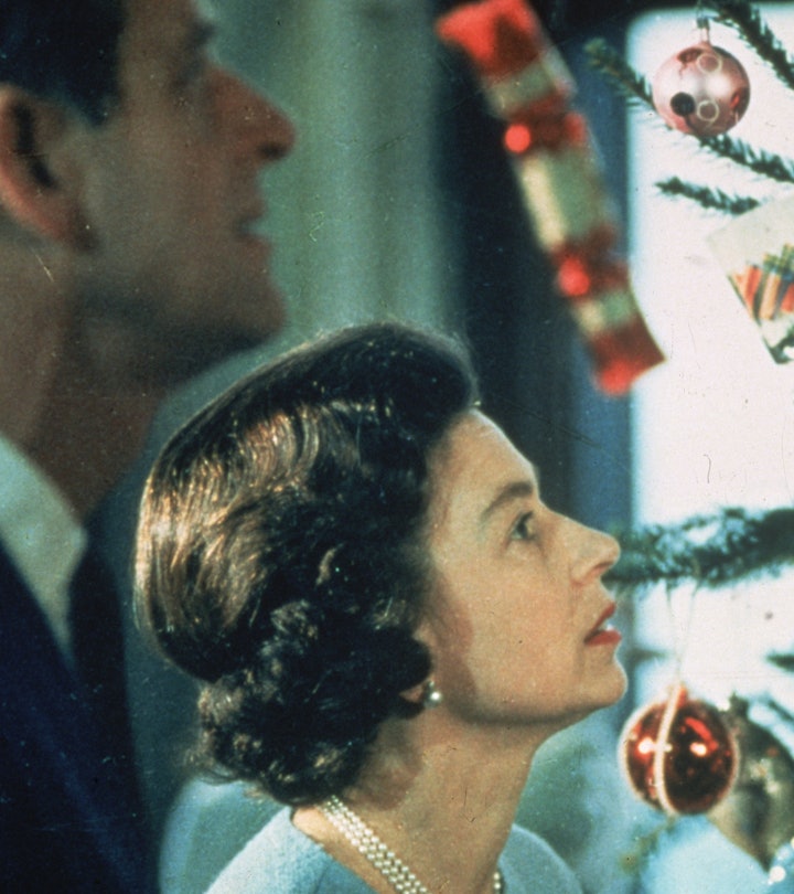 June 1969: Queen Elizabeth II and Prince Philip look at their decorated Christmas tree during the fi...