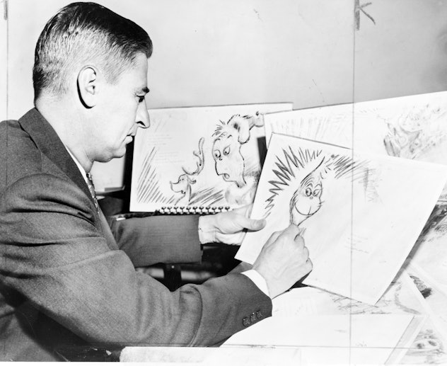 Theodor Seuss Geisel 1904  1991, American writer, poet, and cartoonist at work on a drawing of a gr...