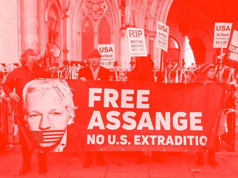 Supporters of WikiLeaks founder Julian Assange, hold placards outside the Royal Courts of Justice in...